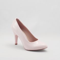 a woman's pink high heeled shoe on a white background with no shoes