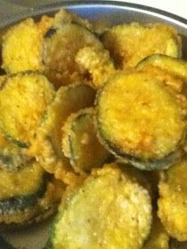 cooked zucchini sitting in a pan on the stove top, ready to be eaten