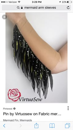 a woman's arm with black and yellow feathers on it, in the middle of an instagram page