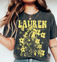 2024 Lauren Daigle The Kaleidoscope Tour Shirt, Thank God I Do, RETRO Lauren Daigle T-shirt, Lauren Daigle Album, unisex shirt for fan ⭐ PRODUCT NAME: American Singer Shirt, Erykah Badu Vintage Shirt, Erykah Badu 90s R&B Shirt, Hip-Hop Retro Graphic Shirt, Gift For Fans Men Women ⭐ INFORMATION: This unisex style t-shirt is suitable for both men and women. For care, wash the item inside out in cold water. Avoid bleach, dry cleaning, and direct ironing on the design. ⭐ MATERIAL DETAILS: Our heavyw Grunge Tops With Custom Fan Merchandise Print, Grunge Custom Print Tops For Fan Merchandise, Grunge Tops With Custom Print For Fans, Spring Band Merch T-shirt With Custom Print, Custom Print Band Merch Tops For Concerts, Band Merch Tops With Custom Print For Concerts, Custom Print Short Sleeve Top For Concert, Concert Graphic Tee With Custom Print, Graphic Tee With Custom Print For Concerts