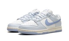 The Women’s Nike Dunk Low Next Nature "Blue Tint" is a women’s-exclusive version of the retro basketball sneaker made with environmentally-friendly materials.  The upper features a white leather base with University Blue leather overlay panels.  A Blue Tint leather Swoosh can be found on either side of the shoe and “Nike” branding is embroidered on the heel.  Classic “Nike” and Swoosh detailing is found on the tongue tag.  A white rubber midsole and royal outsole made with recycled Nike Grind ma Nike Shoes Women Dunks, Nike Low Dunks Women, Blue Tint Dunks Outfit, Nike Dunks Low Women, Nike Shoes Women Blue, Women’s Nike Dunks, Cute Nike Dunks, Nike Blue Shoes