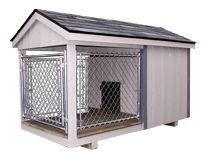 a dog house with a metal fence around it