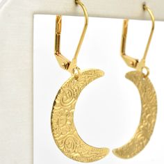 Earrings measure about 1.5" long Gold plated lever-backs Brass earrings Handmade in the USA Handmade in Salem, Massachusetts by WE DREAM IN COLOUR Goldmakers Jewelry Mission Statement Goldmakers Jewelry creates and curates a comprehensive selection of artfully designed hand-crafted jewelry. We aspire to offer the jewelry enthusiast access to affordable classics as well as fresh innovative designs. Symbolic Gold Moon-shaped Earrings, Symbolic Gold Moon Earrings, Moon Shaped Gold Sterling Silver Earrings, Artistic Gold Hoop Earrings With Ear Wire, Gold Brass Jewelry With Lever Back, Artistic Gold Jewelry With Ear Wire, Artisan Gold Crescent Jewelry, Artisan Crescent Gold Jewelry, Brass Half Moon Earrings For Gift