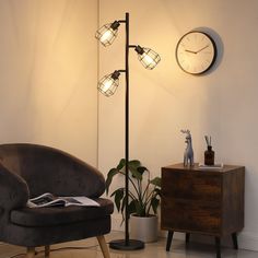 a living room with a chair, lamp and clock on the wall next to it