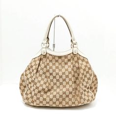 Auth Gucci Sukey Gg Pattern,Beige Dark Brown White Jacquard Leather Some Rubs On Corners ..Piping Is Intact !! [ Measurements ] Height : 10.63 Inch (27 Cm) Width : 12.6 Inch (32 Cm) Depth : 3.15 Inch (8 Cm) Handle : 6.5 Inch White Gucci Bag With Handles, White Gucci Shoulder Bag With Handles, Gucci Cream Shopping Bag, Cream White, Gucci Bag, Piping, Dark Brown, Satchel, Bag Lady