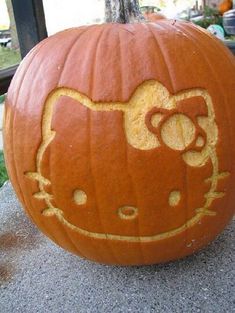 a hello kitty pumpkin carved to look like it is smiling