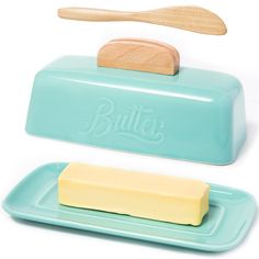 two butter containers with wooden spoons on them and one in the shape of a butter container