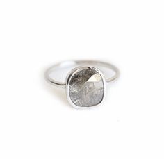 a silver ring with a gray stone on it