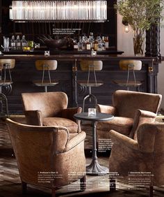 a magazine cover with two chairs and a table in front of a bar filled with liquor bottles