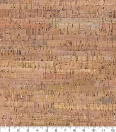 a close up view of a cork wallpaper with brown and tan stripes on it