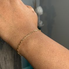 This listing is for an elegant 18K Gold Plated Paper Clip / Rectangle Bracelet. This Gold Paperclip bracelet or anklet is perfect for everyday wear. Perfect for wearing on its own or for layering or stacking with other pieces. Statement piece for yourself or gift for a loved one. . Item Description:  Chain Material: 18K Gold Plated Clasp: 14K Gold Filled Spring Ring Clasp  Pictured is bracelet in 6.5 inches length. Please see link below for a 14K Gold Filled Paper Clip Necklace:  https://www.etsy.com/ca/listing/840078143/gold-paper-clip-chain-gold-paperclip?ref=shop_home_active_12&frs=1&sca=1 For shipping details / gift box option, please see FAQs section or feel free to contact me with any questions :) Thank you for visiting! Paper Clip Bracelet, Paperclip Bracelet, Gold Anklet, Gold Paper, Trombone, Bracelet For Women, Paper Clip, Chain Link Bracelet, Spring Rings