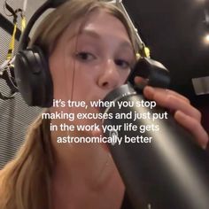 a woman wearing headphones and holding a microphone in front of her face with the words it's true, when you stop making excess and just put in the work your life gets astronomically better