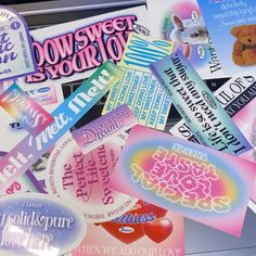 many different types of stickers are on the table together, including one with a teddy bear