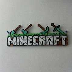 a sign that says minecraft hanging on the wall