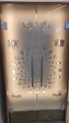 a glass door with an intricate design on it