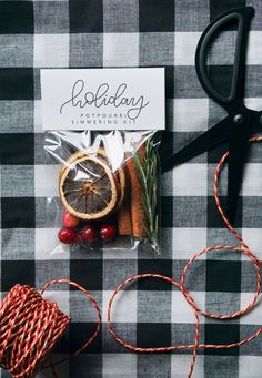 a pair of scissors sitting on top of a table next to some fruit and vegetables