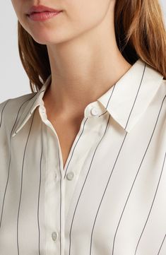 Pinstripes punctuate a creamy-hued button-up shirt that would look just right running the show from the C-suite. 27" length Front button closure Long sleeves with button cuffs 100% polyester Dry clean Imported Classic Button-up Tops With Vertical Stripes, Chic Vertical Stripes Office Shirt, Chic Office Shirt With Vertical Stripes, Chic Vertical Stripes Shirt For Workwear, Pinstripe Collared Shirt For Work, Chic Shirt With Vertical Stripes For Work, Striped Collared Blouse For Work, Elegant White Top With Striped Collar, Elegant White Blouse With Vertical Stripes