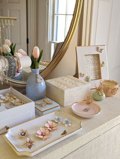 a table topped with lots of different types of jewelry