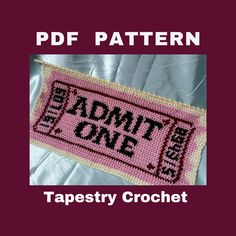 a cross stitch pattern with the words admit one in black and red on it,