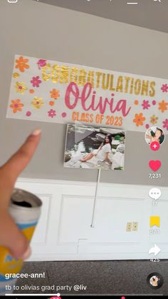 someone is holding up a graduation banner with pictures on it and the words congratulationss