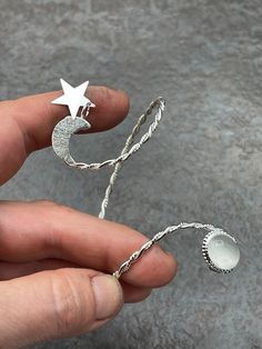 A simplistic and elegant sterling silver bracelet cuff, with a glowing and gorgeous 12x10mm oval moonstone cabochon. Also, when ordering, please tell me your wrist size so I can have this fit you perfectly! I make each piece, per order! This is meant to wear on the lower forearm area as per shown in the listing photos. Shipping is First Class with Delivery Confirmation, within the US, and First Class International outside. *SIZING GUIDE* Take a snug wrist measurement and add 1 inch to determine Celestial Sterling Silver Bracelets, Silver Celestial Bracelets For Gift, Silver Celestial Bangle Jewelry, Silver Moon-shaped Bracelet For Gifts, Celestial Silver Bangle Jewelry, Handmade Celestial Silver Bracelets, Silver Moon-shaped Sterling Silver Bracelet, Sterling Silver Bracelets With Moon Charm, Sterling Silver Celestial Bracelet