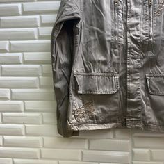 "PLEASE READ DESCRIPTION BELOW BEFORE BUYING👇🏻 *ITEM:Kookai Jacket *ITEM DETAILS: 👇🏻 Please be aware that all vintage items will usually show a few signs of wear or fading due to age, but anything visible such as stains or holes, and serious flaws have been photographed.For any further information on this item please contact us and we will be happy to help. *SIZE:38 *ACTUAL SIZE MEASUREMENT: 👇🏻 *PIT TO PIT(WIDTH):18\"INCHES *LENGTH(FROM SHOULDER): 24\"INCHES *ALL MEASUREMENTS ARE TAKEN WIT Casual Embroidered Outerwear For Outdoor, Khaki Long-sleeved Parka With Multiple Pockets, Khaki Long Sleeve Parka With Side Pockets, Utility Style Long Sleeve Khaki Parka, Khaki Long Sleeve Utility Parka, Khaki Cotton Parka With Pockets, Casual Khaki Parka With Patch Pockets, Khaki Long Sleeve Parka With Patch Pockets, Khaki Spring Parka With Patch Pockets