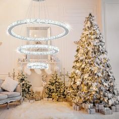 a living room decorated for christmas with lights and presents on the floor, trees in front of them