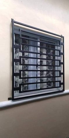 a wall mounted window with blinds on it