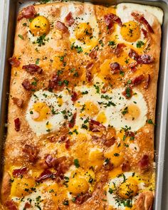 an egg and cheese casserole in a baking pan with parsley on top