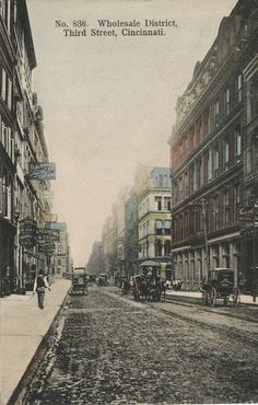 an old black and white photo of a city street