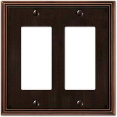 two toggles are shown on the wall in this dark wood finish with brass accents