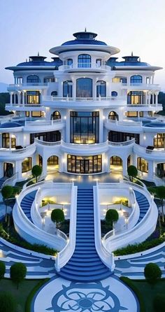 a large white building with stairs leading up to it's top floors and windows