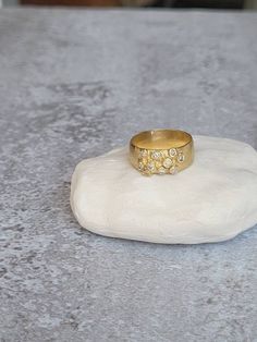 This is a 14 karat gold ring with salt and pepper diamonds gems. Its a beatifull statement ring that can be an anniversary or engagement ring, or a beautiful ring for yourself. ITEM DETAILS Material: The ring is one of a kind, made of 14 karat gold. The diamonds are salt and pepper diamonds that are set inside the 10 corals of the ring. Sizes: you can order this ring in sizes 5-10 If you need any other size, please let me know. You can choose the ring in 14 karat gold, sterling silver or black o Modern Gold Diamond Cluster Ring, Gold Wide Band Diamond Ring With Single Cut Diamonds, Elegant Wide Band Jewelry With Rose Cut Diamonds, Elegant Wide Band Rose Cut Diamond Jewelry, Gold Wide Band Ring With Single Cut Diamonds, Unique Gold Rings With Cubic Zirconia, Unique Gold Cubic Zirconia Rings, Unique Rose Cut Diamond Ring, Gold Dome Ring With Bezel Setting Diamond