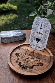 Card of the Day Tarot Tray. A beautiful addition to any altar. Big enough to hold your deck and display the card you wish to meditate on. 8" tray will hold a standard deck with space. 6" tray will hold a standard sized deck snugly, a mini deck with more room to spare.  Dimensions: 8" in diameter by 0.5" thick, 6" in diameter by 0.5" thick. Material: Acacia Wood Due to the nature of this material, grain and color will vary. Moth Tarot Card, Tarot Altar, Mini Deck, Woodburning Projects, Incense Holders, Decorative Trays, Wood Tray, Dremel, Tarot Card