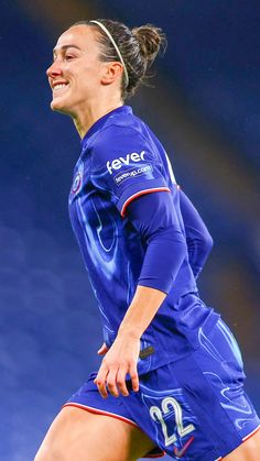 a female soccer player in action on the field