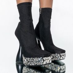 Refresh Your Shoe-Drobe With The Azalea Wang Diamonds Walk Runway Chunky Bootie In Black. This Square Toe Platform Bootie Features A Knit Upper, And A Rhinestone Embellished Platform Sole. Complete With A Sculptural Chunky Heel, An Ankle Height Shaft, And A Tonal Side Zipper Closure. -All Man-Made Materials -Square Toe - 6” Heel - 2” Sole - 6” Shaft