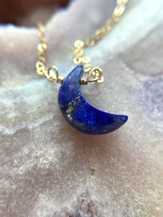 "Stunning 16mm blue Lapis Lazuli Crescent moon pendants have been made into a beautiful crystal necklace. In options of gold or silver this necklace is a show stopper. Perfect gift for that special someone in your life, they will cherish this handmade piece for years to come and will be a luxurious classic necklace to add to their wardrobe. This piece looks great worn alone or layered with other classy pieces. Handcrafted Lapis Lazuli Moon Pendant Necklace *Beautiful gift for her *High quality g Celestial Round Crystal Necklace For Gift, Celestial Moon Charm Crystal Necklace, Celestial Crystal Necklace With Moon Charm, Blue Crescent Gemstone Jewelry, Celestial Crystal Necklace With Moon Charm As Gift, Blue Moon Charm Necklace Gift, Blue Moon Charm Necklaces For Gifts, Celestial Crescent Crystal Necklace For Gift, Blue Moon Charm Necklace For Gift