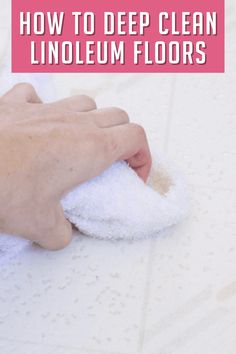 a person wiping up the floor with a towel and rag on it, text reads how to deep clean linoleum floors