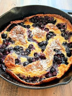 a blueberry cobbler in a cast iron skillet