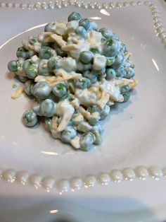 a white plate topped with blue and green candies