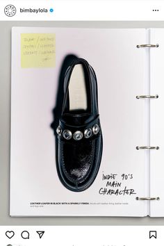 a note book with an image of a pair of shoes on top of the page