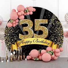 a black and gold 45 happy birthday banner surrounded by balloons