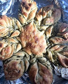 some breads that are sitting on tin foil