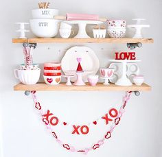 the shelves are decorated with valentine's day decorations