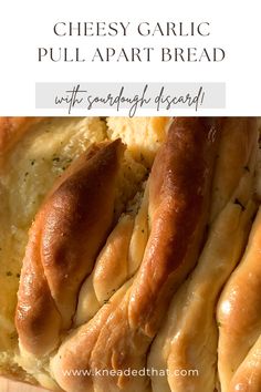 cheesy garlic pull apart bread on a cutting board with text overlay reading cheesy garlic pull apart bread