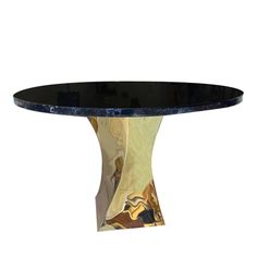 a black and gold table with an oval glass top