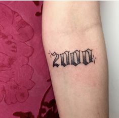 a woman's arm with a tattoo on it that reads, 20 / 7