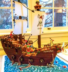 a cake shaped like a pirate ship on top of a table