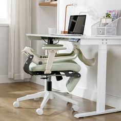 an office chair that is sitting in front of a desk with a computer on it