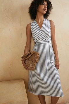 Designed in a timeless wrap cut, this midi dress features an A-line skirt and sleeveless finish. Complete with a defined waistline in a contrasting stripe. Model wears a size 8 and is 5'9. Structured Summer Dress, Striped Wrap Dress, Wrap Dress For Work, 2024 Outfits Summer, Summer Dress 2024, A Line Cotton Dress, A Line Dresses For Women, Striped Dress Fall, Wrap Dress Work